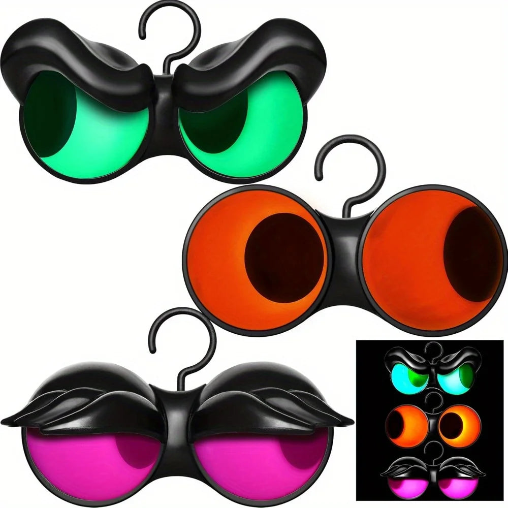 Flashing peeping eyes 3 pack: green and magenta pairs with black brows and an orange pair without brows, each with a hanging hook