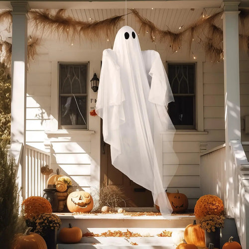 47 in white hanging ghost hanging from a porch ceiling above steps with pumpkins