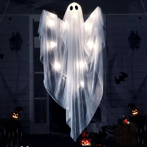 Hanging ghost glowing with white LED lights inside at night