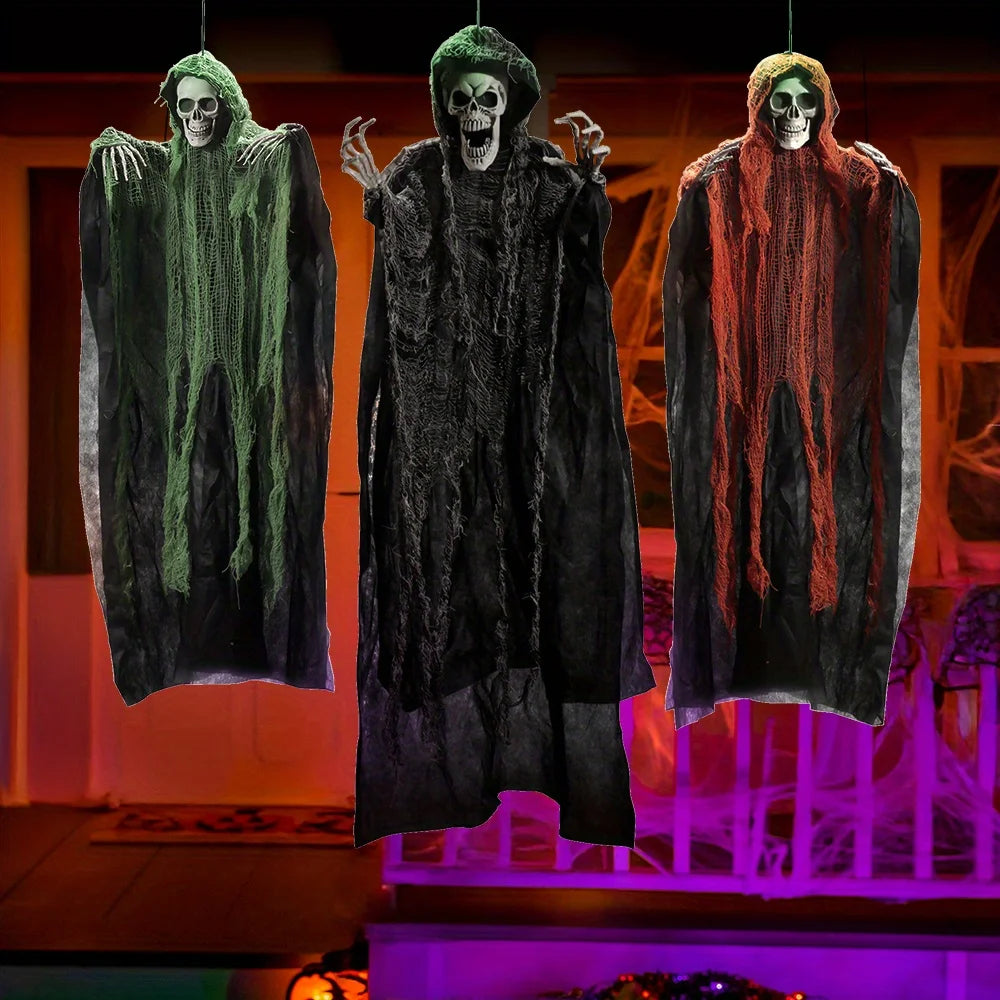Hanging grim reapers 3 pack in green, black and orange outside a house lit orange and purple